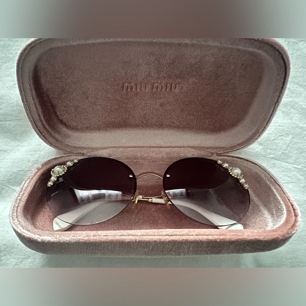 Elegant Miu Miu's Manière Sunglasses with pearl
Embellishments